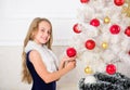 Winter holiday concept. Family holiday concept. Girl velvet dress feel festive near christmas tree. Very special time of Royalty Free Stock Photo