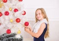 Winter holiday concept. Family holiday concept. Girl velvet dress feel festive near christmas tree. Very special time of Royalty Free Stock Photo