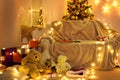 Winter holiday concept - Interior with new year or christmas decoration. At night, the room glows with festive lights. A lots of Royalty Free Stock Photo