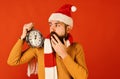 Winter holiday and countdown concept. Santa Claus waits for midnight Royalty Free Stock Photo