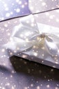 Winter holiday gift and glowing snow background, Christmas presents surprise