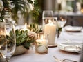 Winter holiday season festive dining table decoration with candles and beautiful tableware, elegant table decor