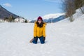 Winter holiday trip to snow valley - young happy and excited Asian Korean woman playful on frozen lake in snowy mountains at Swiss