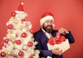 Winter holidays. Boxing day. Christmas party. Sharing kindness and happiness. Prepare gifts for everyone. Man bearded Royalty Free Stock Photo