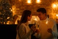 Winter holidays, Christmas celebrations, New Year concept. Portrait of happy smiling couple with champagne glasses Royalty Free Stock Photo