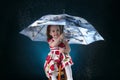 winter, holidays, christmas concept - beautiful little girl having fun with snow flakes, studio shot. Royalty Free Stock Photo