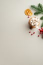 Winter holidays concept. Top view vertical photo of cup of hot chocolate with marshmallow anise dried orange slices mistletoe