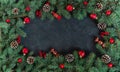 Christmas dark grunge background, fir twigs, top view. Royalty Free Stock Photo