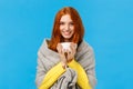 Winter holidays, people and emotions concept. Cheerful lovely and romantic redhead woman came home, warming with hot tea