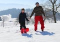 Winter holidays playing with bob on the snow in winter Royalty Free Stock Photo