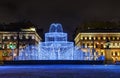 Winter holidays. Street Christmas decorations in the evening. Admiralty building, Winter fountain of hundreds of small lights in