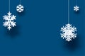 Winter horizontal blue background with white paper kirigami snowflakes