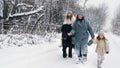 winter horse ride. horseback riding at winter. family horseback ride on snowy winter day. Happy cutie, little girl is Royalty Free Stock Photo