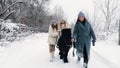 winter horse ride. horseback riding at winter. family horseback ride on snowy winter day. Happy cutie, little girl is Royalty Free Stock Photo