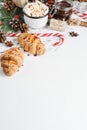 Christmas hot chocolate or cocoa with marshmallow, cookies on white background with christmas decorations. Flat Lay. Royalty Free Stock Photo