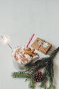 Winter hot drink with gingerbread men cookie, sparkler and christmas decoration on the wooden white table Royalty Free Stock Photo