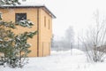 Winter house in nature forest snow panoramic. Spruce or fir tree in the snow against the house on the Christmas and New Royalty Free Stock Photo