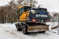 Winter Hyundai wheel excavator with bucket of sand