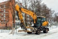 Winter Hyundai wheel excavator with bucket of sand