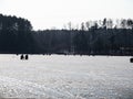 Winter ice fishing, lake, forest, frosty day. fishermans Royalty Free Stock Photo