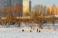 Winter ice fishing, lake, frosty day. Fisherman engaged in ice fishing in the pond of the city Park Royalty Free Stock Photo