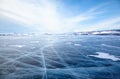 Winter ice landscape on lake Baikal with dramatic weather clouds Royalty Free Stock Photo