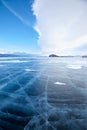 Winter ice landscape on lake Baikal with dramatic weather clouds Royalty Free Stock Photo