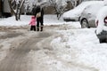 Winter. People walk on a very snowy roads. People step on an snow-stray pathway. Icy sidewalk. Ice on sidewalks Royalty Free Stock Photo