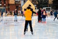 Winter ice rink. Happy boys have fun on ice. Active family sport during Christmas winter break. School sports clubs. Dnipro city