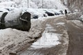 Winter. Ice on roads. Heavy snowfall in the city, snowy icy roads, snowy sidewalks, broken broken branches, uncleaned streets Royalty Free Stock Photo