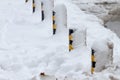 Winter. Ice. Snow. People walks a snowy icy road passing snowy cars on uncleaned icy street after a heavy snowfall. Unclea Royalty Free Stock Photo