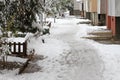 Winter. Ice. Snow. People walks a snowy icy road passing snowy cars on uncleaned icy street after a heavy snowfall. Unclea Royalty Free Stock Photo