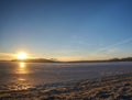 Winter icy river bay. Clear winter morning. Sand with hoarfrost Royalty Free Stock Photo