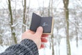 Winter idea. Male holding a book with the inscription Brr the background of the forest Royalty Free Stock Photo