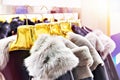 Winter jackets with grey fur collars in clothing store Royalty Free Stock Photo