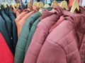 Winter jackets on a hanger in the store Royalty Free Stock Photo