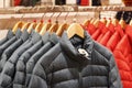 Winter jackets on a hanger in the store close-up Royalty Free Stock Photo