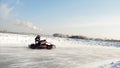 Winter karting competition on the ice track. Clip. Motion of go kart race in winter Royalty Free Stock Photo