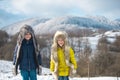 Winter kids. Adorable little girl and boy having fun on snowy day. Children wiht snow. Royalty Free Stock Photo