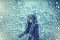 Winter Kids and nature. Cute child in Winter park trees covered with snow. Outdoor portrait of cute baby kid in cold Royalty Free Stock Photo