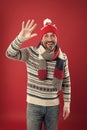 Winter knitwear. Knitwear accessories. Mature man red background. Bearded man in winter style. Caucasian man wear warm
