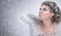 Winter lady blowing in hand Royalty Free Stock Photo
