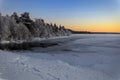 Winter lake in Finland at sunset Royalty Free Stock Photo