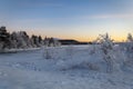 Winter lake in Finland at sunset Royalty Free Stock Photo