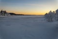 Winter lake in Finland at sunset Royalty Free Stock Photo