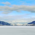 Winter lake and mountains landscape