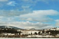 Winter lake, mountains and town Royalty Free Stock Photo