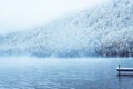 Winter lake with a pier for boats. Royalty Free Stock Photo