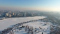 Winter lake and village seen from drone, snow