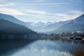 Winter lakeside scene with snow covered mountains